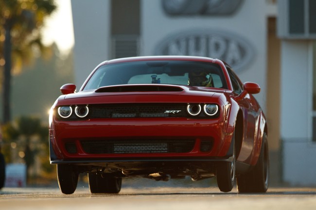 The 2018 Dodge Challenger SRT Demon, powered by an 840-horsepower supercharged 6.2-liter HEMI® V-8, is the worlds first production car to lift the front wheels at launch. It set the world record for longest wheelie from a standing start by a production car at 2.92 feet, certified by Guinness World Records. The Dodge Challenger SRT Demon was unveiled Tuesday evening, April 11, ahead of the New York International Auto Show. (PRNewsfoto/FCA US LLC)
