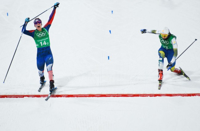 PYEONGCHANG-GUN, SOUTH KOREA - FEBRUARY 21: Jessica Diggins of the United States (14-2) stretches across the finish line to win gold ahead of Stina Nilsson of Sweden (12-2) during the Cross Country Ladies' Team Sprint Free Final on day 12 of the PyeongChang 2018 Winter Olympic Games at Alpensia Cross-Country Centre on February 21, 2018 in Pyeongchang-gun, South Korea.