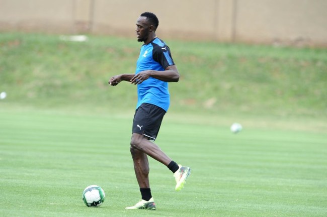 usain bolt playing soccer