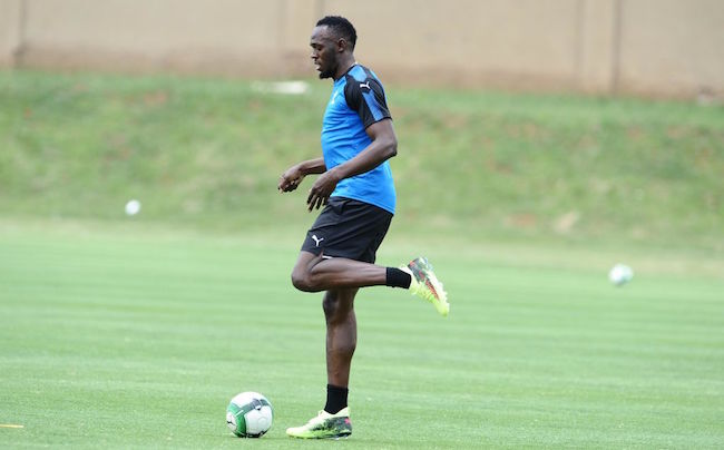 usain bolt playing soccer
