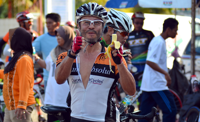 cyclist eating banana