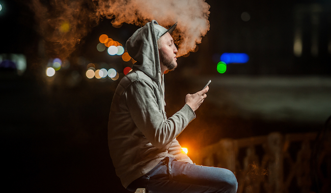 smoking and looking at phone
