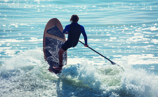 paddle boarding wave