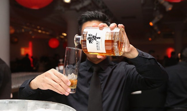 pouring suntory hibiki whiskey