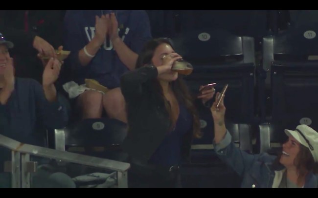 woman catches foul ball chugs beer