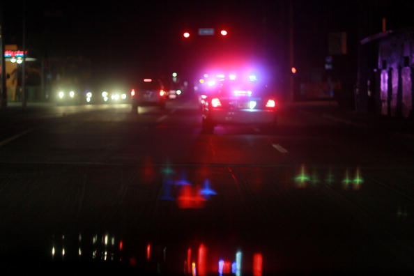 MIAMI - AUGUST 11: A City of Miami police car with lights ablaze responds to a call as they patrol the street on August 11, 2010 in Miami, Florida. The Miami Police Department launched "Operation Take Back Our Streets" yesterday in response to recent shootings in the Model City and Little Haiti communities of Miami. The city has seen a number of shootings recently using high powered assault weapons.  (Photo by Joe Raedle/Getty Images)