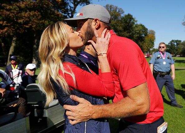 CHASKA, MN - SEPTEMBER 30: Paulina Gretzky kisses Dustin Johnson of the United States after the end of the round during morning foursome matches of the 2016 Ryder Cup at Hazeltine National Golf Club on September 30, 2016 in Chaska, Minnesota. (Photo by Streeter Lecka/Getty Images)