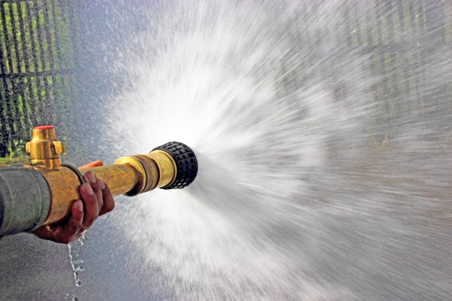 Firefighter fighting For A Fire Attack, During A Training Exercise