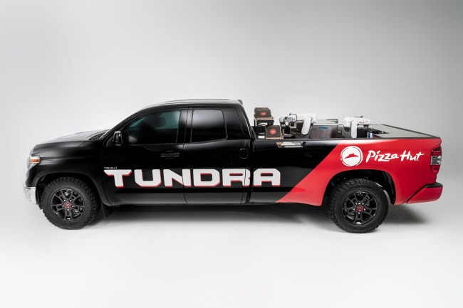 Toyota collaborated with its Plano, Texas, neighbor, Pizza Hut, and Nachi Robotic Systems to create an automated pizza-making vehicle. The Tundra PIE Pro is built to run entirely on a hydrogen fuel cell electric power unit adapted from the Toyota Mirai, which both drives the vehicle forward and powers the self-contained Kitchen built into the trucks bed.
