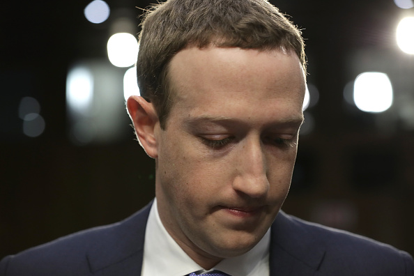 WASHINGTON, DC - APRIL 10:  Facebook co-founder, Chairman and CEO Mark Zuckerberg arrives to testify before a combined Senate Judiciary and Commerce committee hearing in the Hart Senate Office Building on Capitol Hill April 10, 2018 in Washington, DC. Zuckerberg, 33, was called to testify after it was reported that 87 million Facebook users had their personal information harvested by Cambridge Analytica, a British political consulting firm linked to the Trump campaign.  (Photo by Chip Somodevilla/Getty Images)