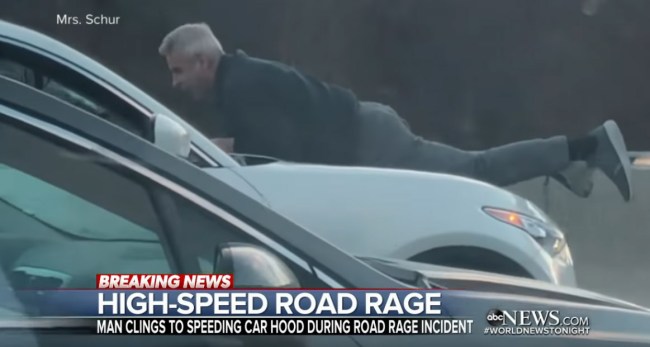 man clings to hood of suv in wild road rage incident video