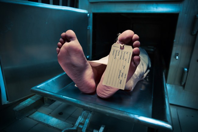 Feet on a morgue table with toe tag