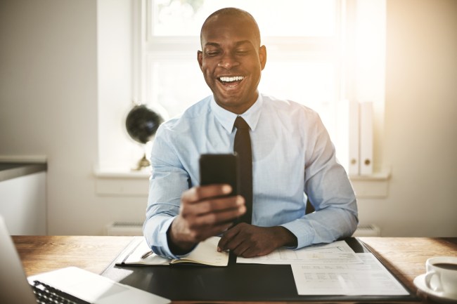 laughing at phone