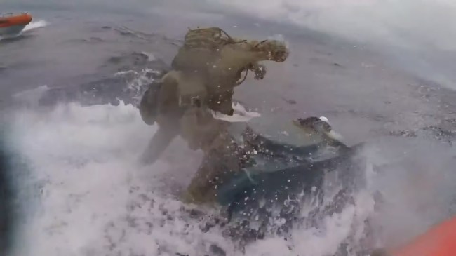 Coast Guardsman Jumps On Submarine Bangs On Hatch In Middle Of Chase