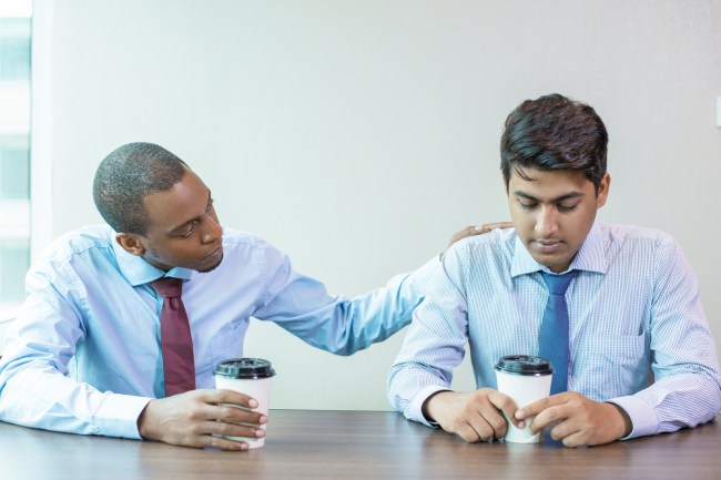 Sad business colleagues discussing bad news