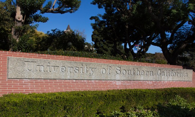 Los Angeles business executive Devin Sloane was sentenced to four months in prison for paying $250,000 to get his son admitted to the University of Southern California as a fake water polo recruit.