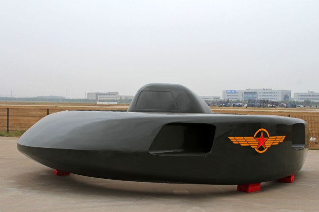 Experimental attack helicopter that looks like a UFO flying saucer unveiled in China. The strange stealth flying machine is called the Great White Shark and can travel at 400 MPH.