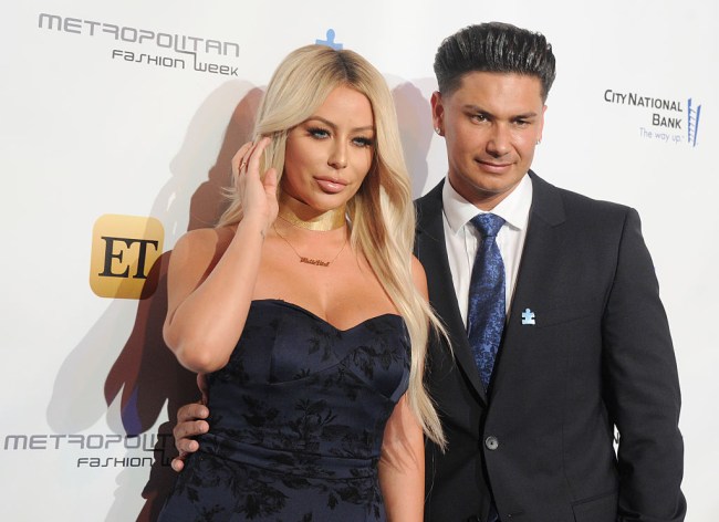 Aubrey O'Day claims an American Airlines flight attendant forced the singer to take her shirt off “in front of the entire plane”