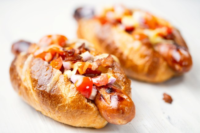 Competitive eater Kate Ovens ate 3-foot-long hot dog with five types of bacon and melted cheese known as the “BFD” at Four Pure Brewery in east London.