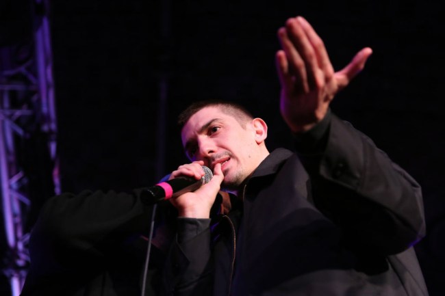 Comedian Andrew Schulz roasts father and daughter at stand-up comedy show in YouTube video.