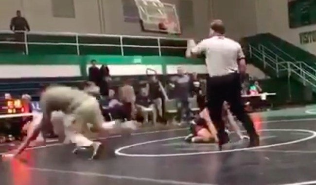 dad tackles son wrestling opponent