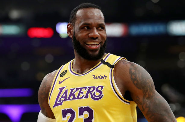 lebron james shoots three lakers logo
