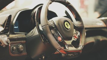 Watching Ian Poulter Casually Hit A Chip Shot Through A Ferrari’s Windows Is Making My Palms Sweat