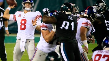 Photo Of Football Fan On Flight Watching The Giants-Eagles Game Instead Of The Presidential Debate Goes Viral