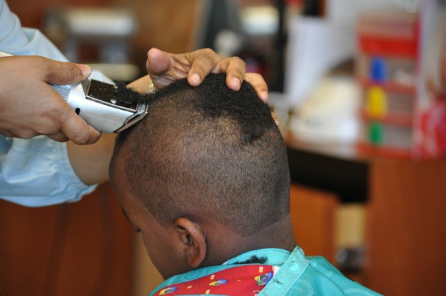 Instead of sending home a student who got in trouble on his first day of school for refusing to take off his hat, an Indianapolis principal cut his hair instead.
