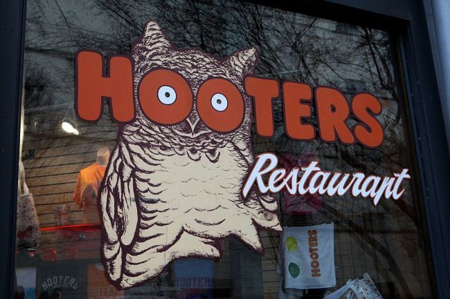 A self-described “flat-chested” med student working at Hooters reveals how she maximizes her breast size in viral TikTok video.
