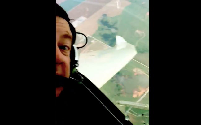A pilot named David films himself circling a tornado while getting as close as possible to it