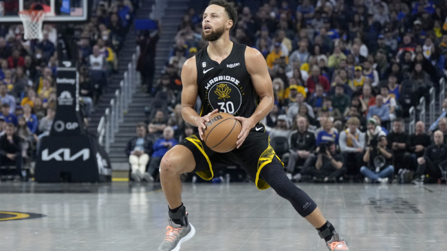 Steph Curry steps back for a jumpshot.