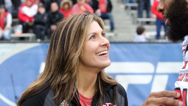 Brittany Wagner talks to a player on the EMCC sidelines.