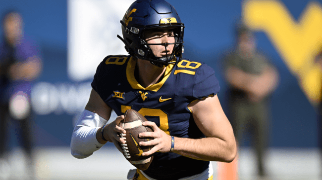JT Daniels throws a pass for West Virginia.