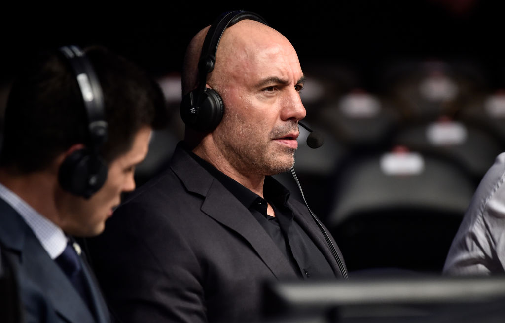 Joe Rogan sitting cageside watching UFC fight 