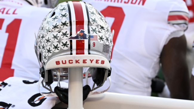 An Ohio State helmet rests on the sidelines.