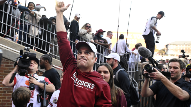 Shane Beamer walks off the field after a win.