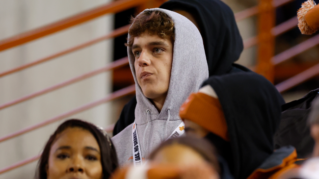 Arch Manning watches a Texas game.