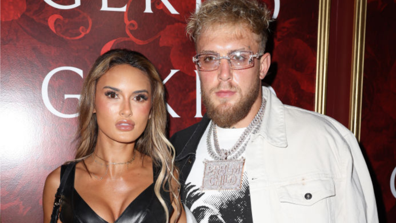 Jake Paul and Julia Rose posing for red carper