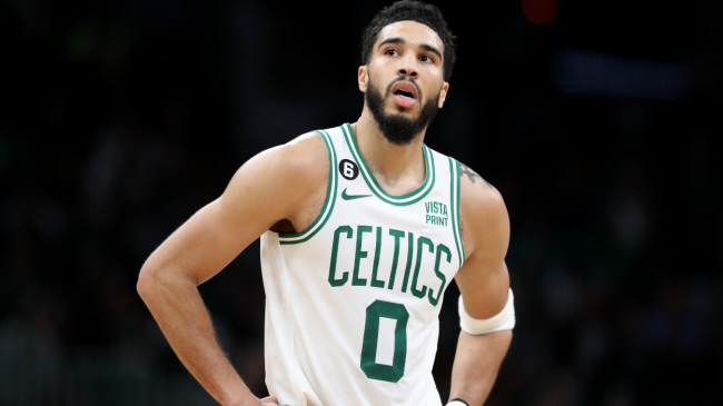 Jayson Tatum stands on the court.