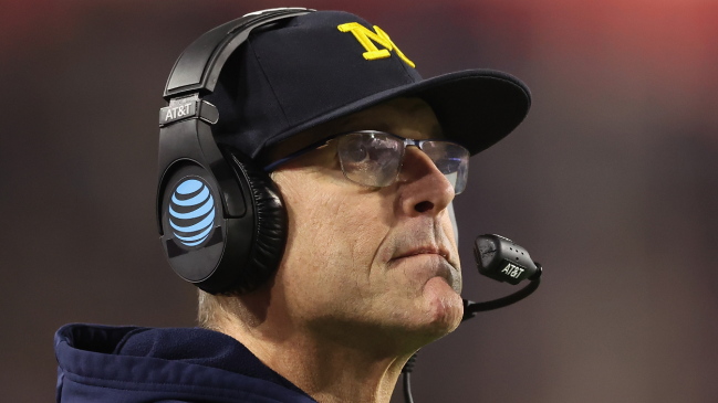 Jim Harbaugh coaches from the sidelines.