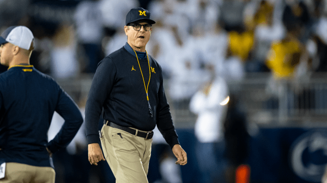 Jim Harbaugh looks on at a Michigan game.