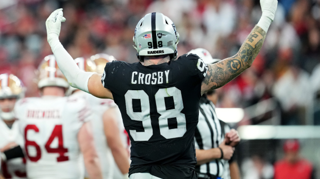 Maxx Crosby celebrates a play.