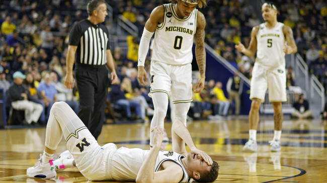 Hunter Dickinson reacts to being hit in the eye.