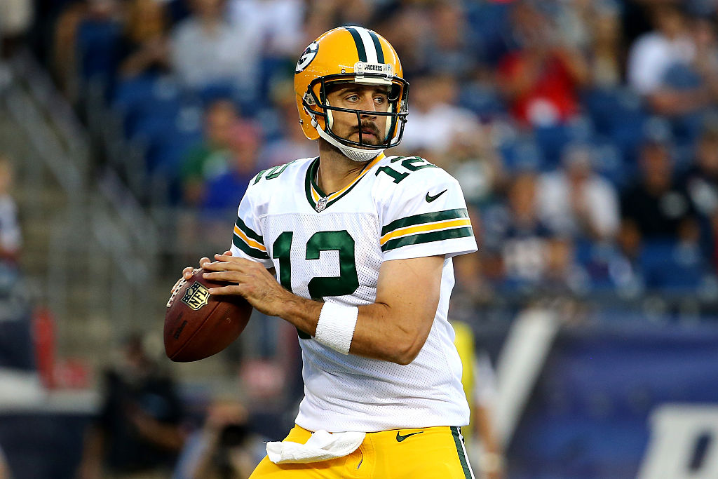 Aaron Rodgers throwing the football