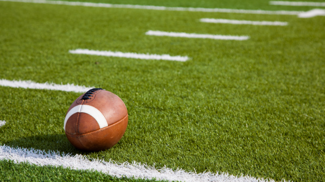 A football on a field.