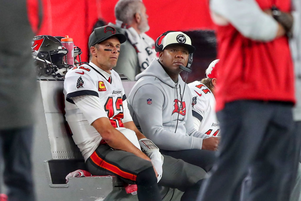Tom Brady sitting on the bench