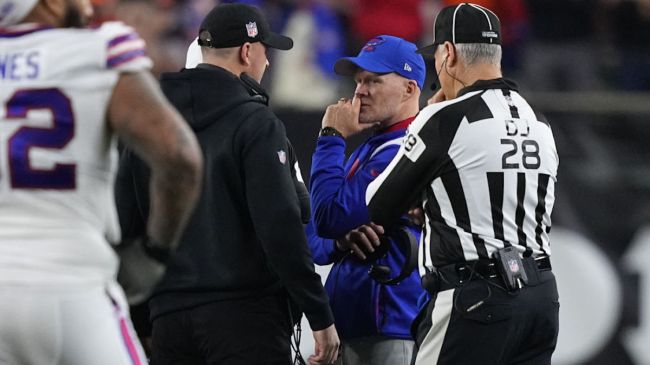 zac taylor sean mcdermott having a discussion on the field