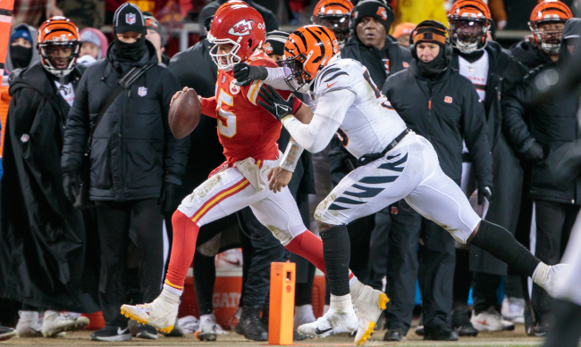 Joseph Ossai tackles Patrick Mahomes out of bounds