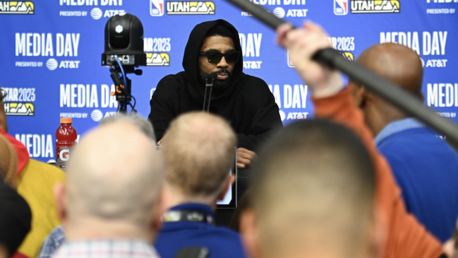 Kyire Irving speaks to the press.